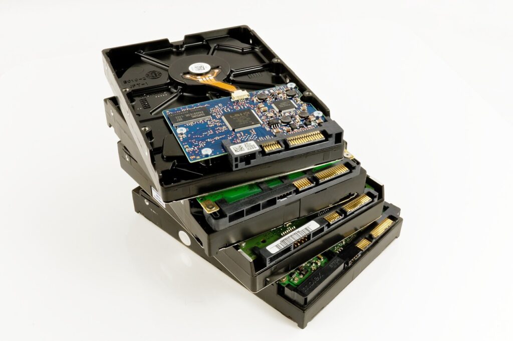 Images of multiple HDDs laid in a stack. Concept image for using multiple HDDs in old Gaming PC used as a NAS device.