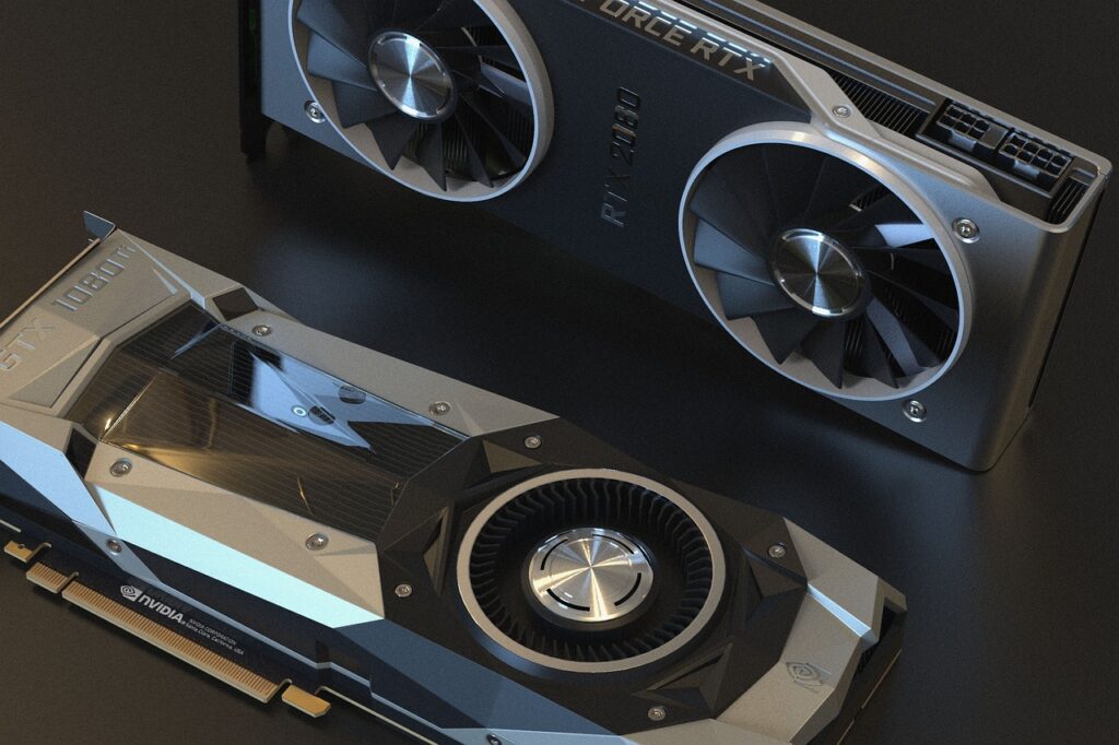 Pictures of two graphics cards laying over a gray colored back ground. Concept image of using old graphics card for video editing and lifespan of gaming PC.