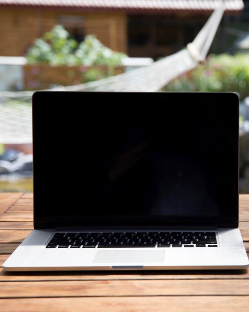 A laptop placed on a table used by a developer for game development.