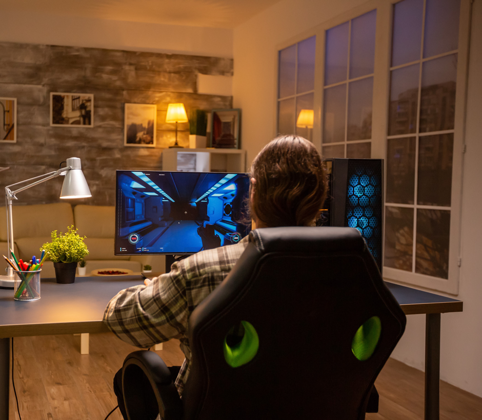 A Person Playing games on his gaming PC.