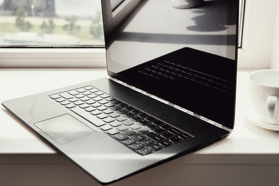 An ASUS gaming laptop placed on a table.