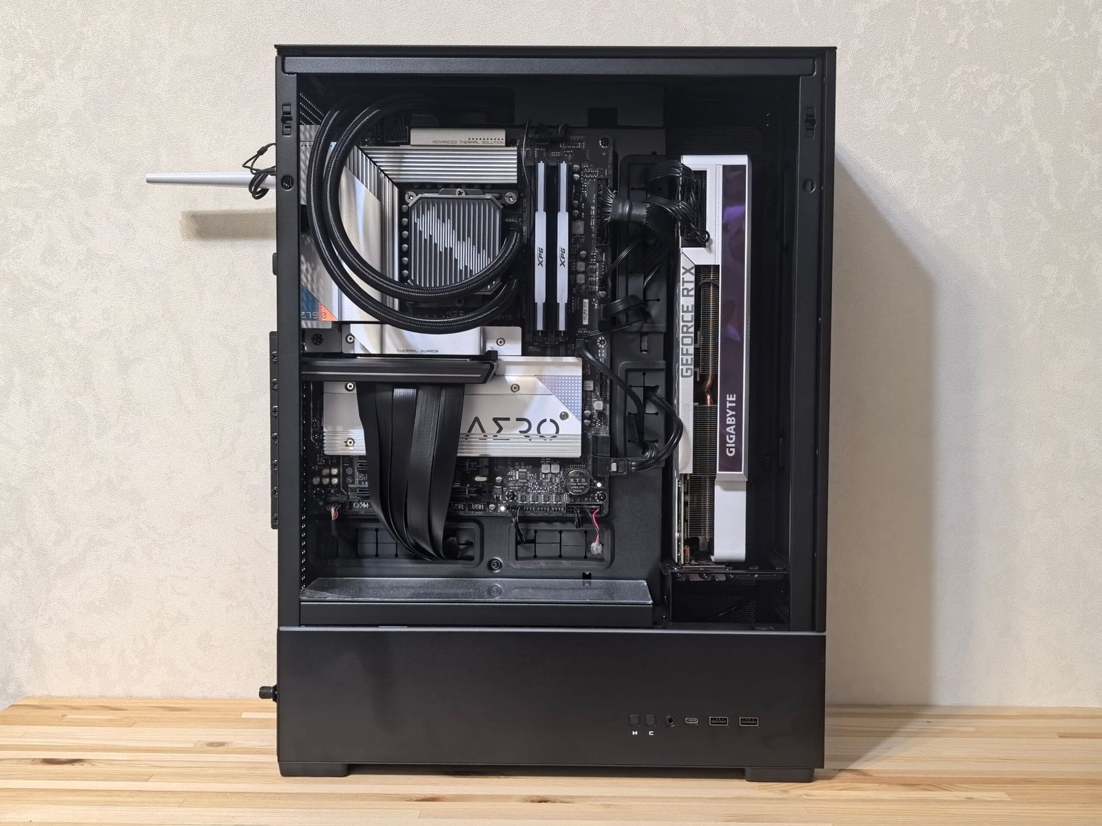 Interior of a gaming PC showing the graphics card, cooling and power supply